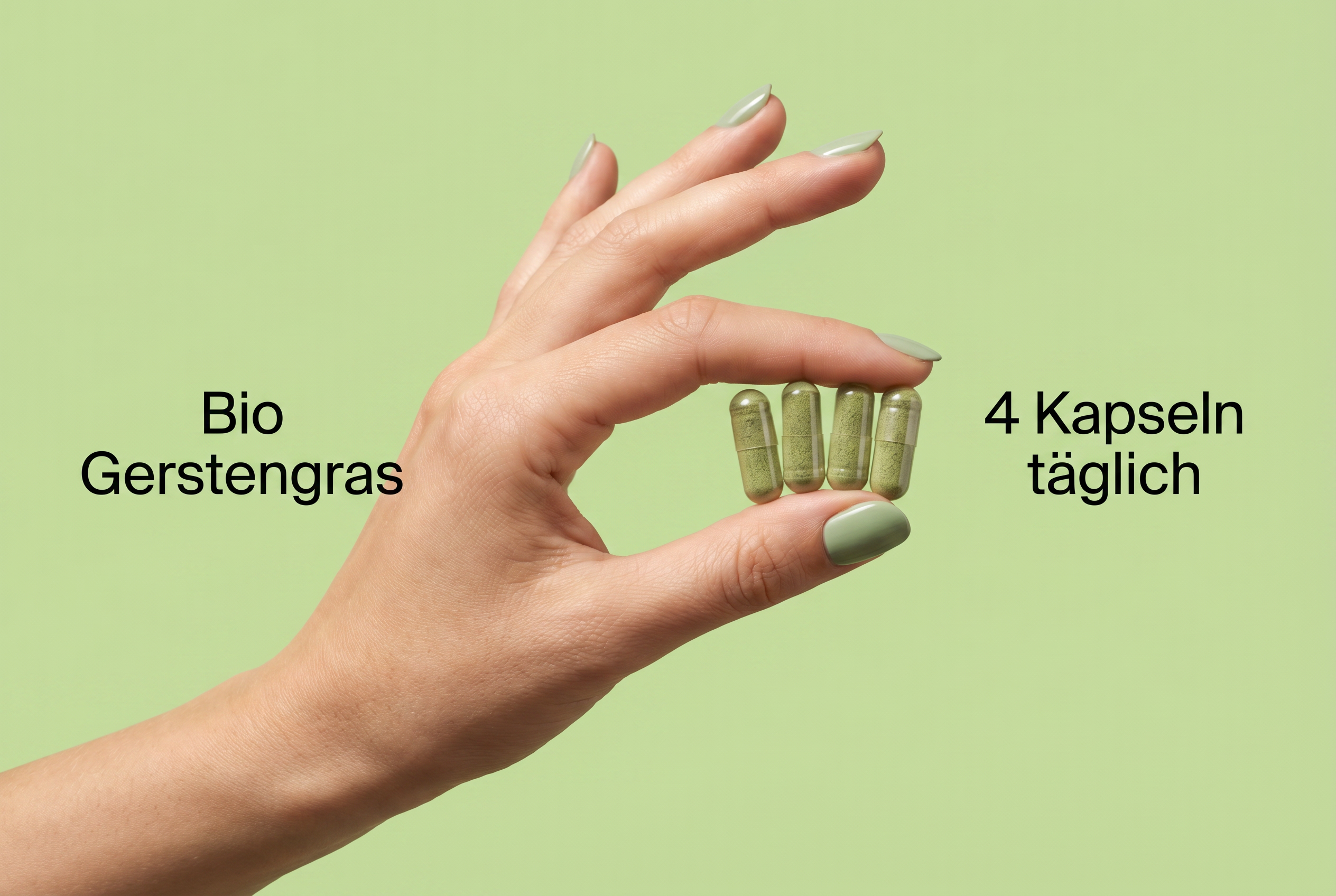 Hand hält vier vegane Bio Gerstengras Kapseln für die tägliche Einnahme